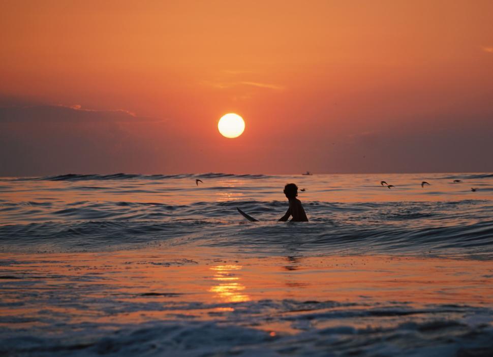 Free Image of A person on a surfboard in the ocean 