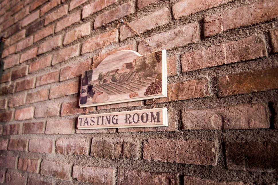 Free Image of A sign on a brick wall 