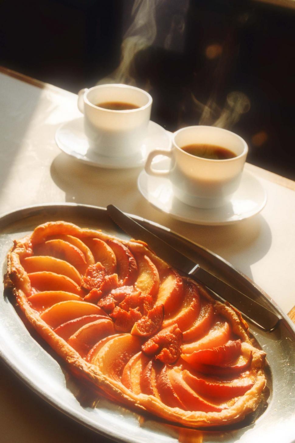Free Image of Peach Tart with Two Cups of Cofee 