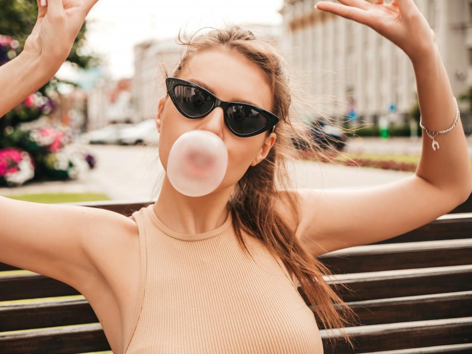 Free Image of A woman blowing a bubble 