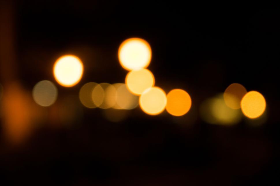 Free Image of A blurry image of lights at night 