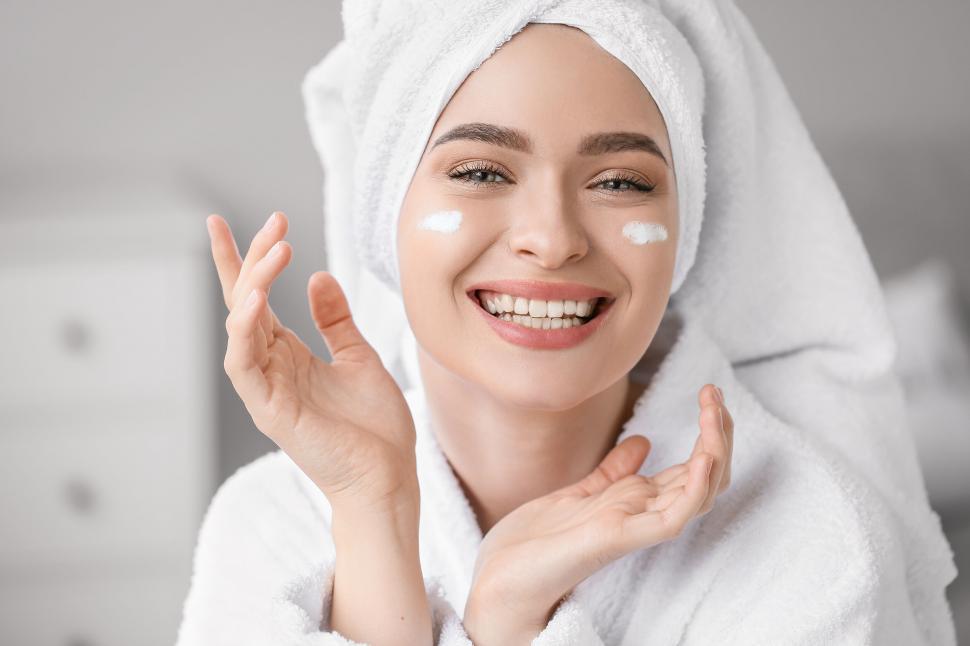 Free Image of A woman with a towel on her head and a towel on her head 