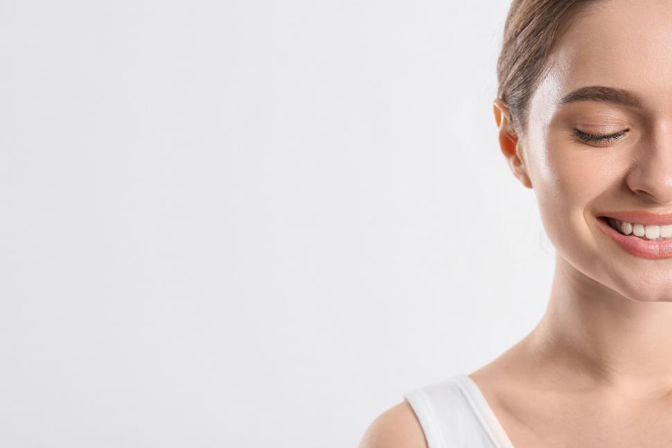 Free Image of A woman with a white tank top 