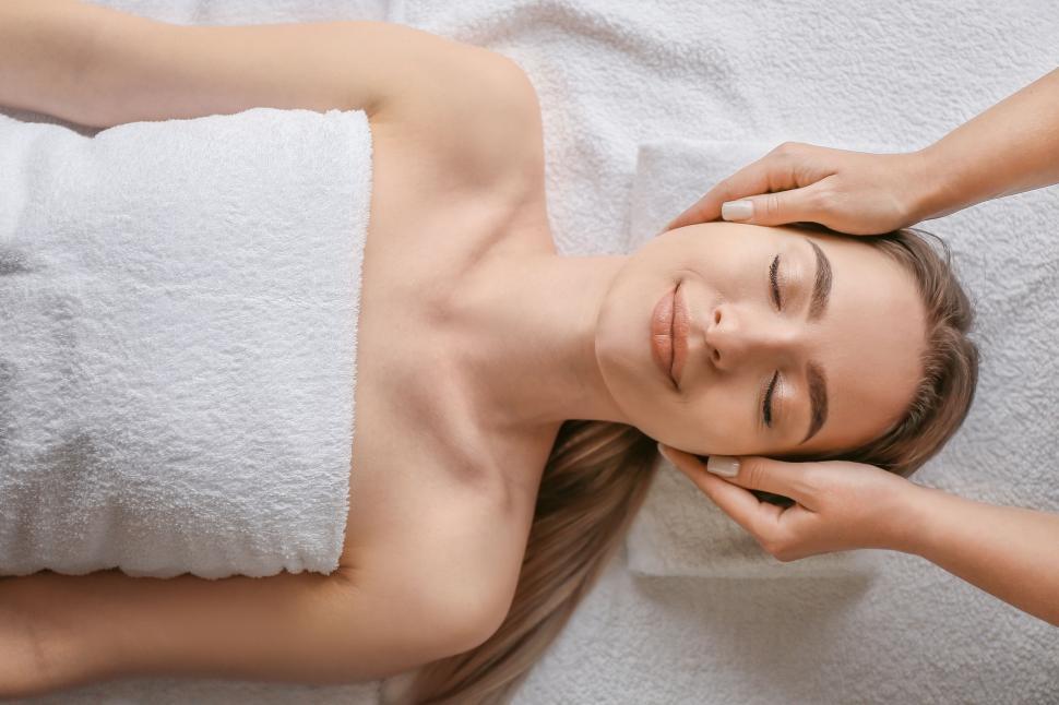 Free Image of A woman lying down with her eyes closed 