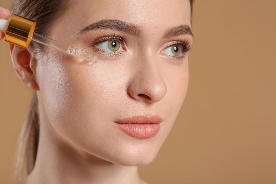 Free Image of A woman applying a dropper on her eye 