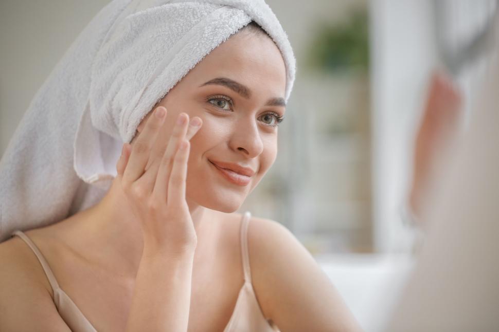 Free Image of A woman with a towel on her head 