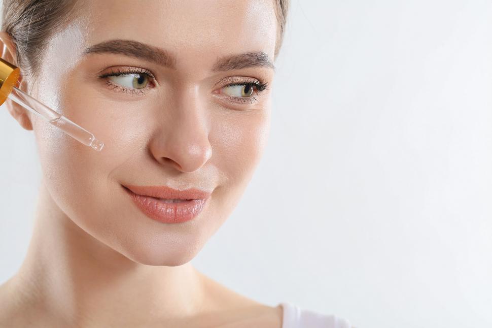 Free Image of A woman with a drop of water on her face 