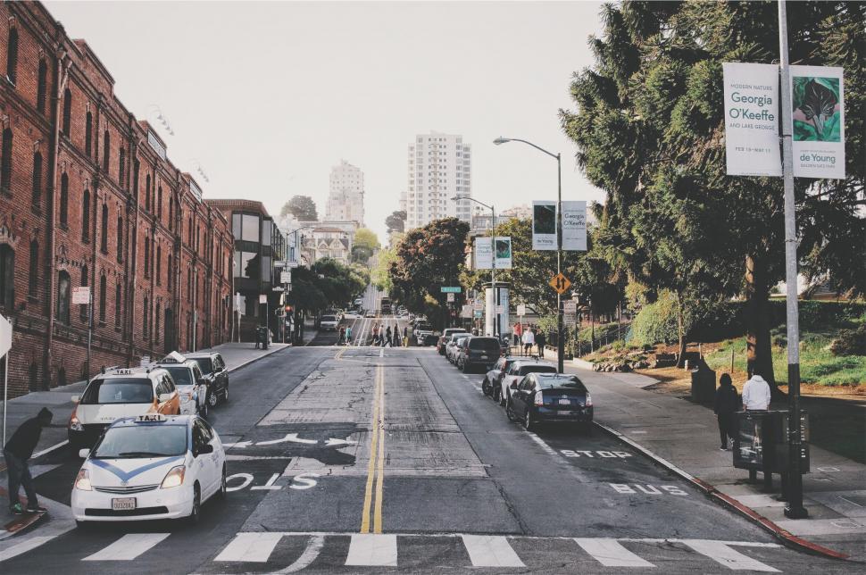 Free Image of A street with cars and buildings 