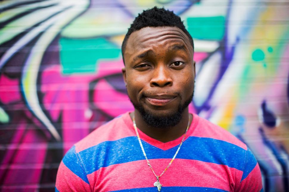 Free Image of A man in a striped shirt 