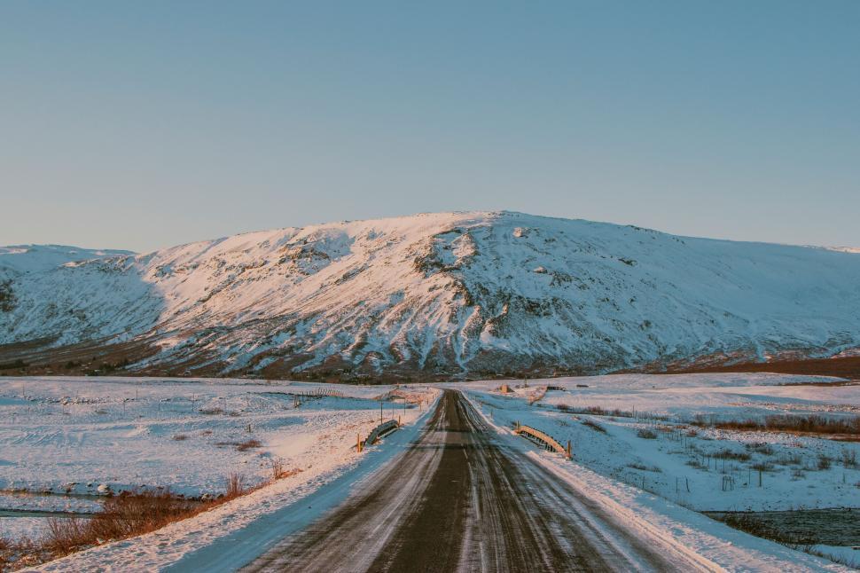 Free Image of A road with snow on the side 