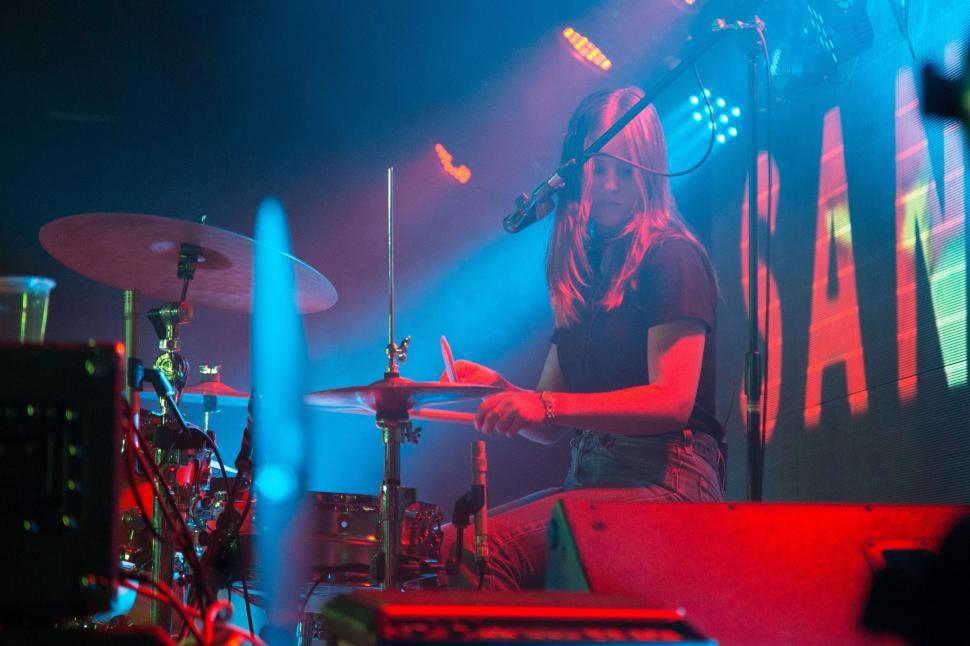 Free Image of Female drummer performing on stage 