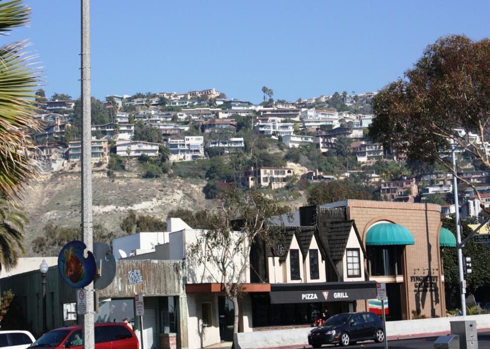 Free Image of City Skyline With Hill in Background 