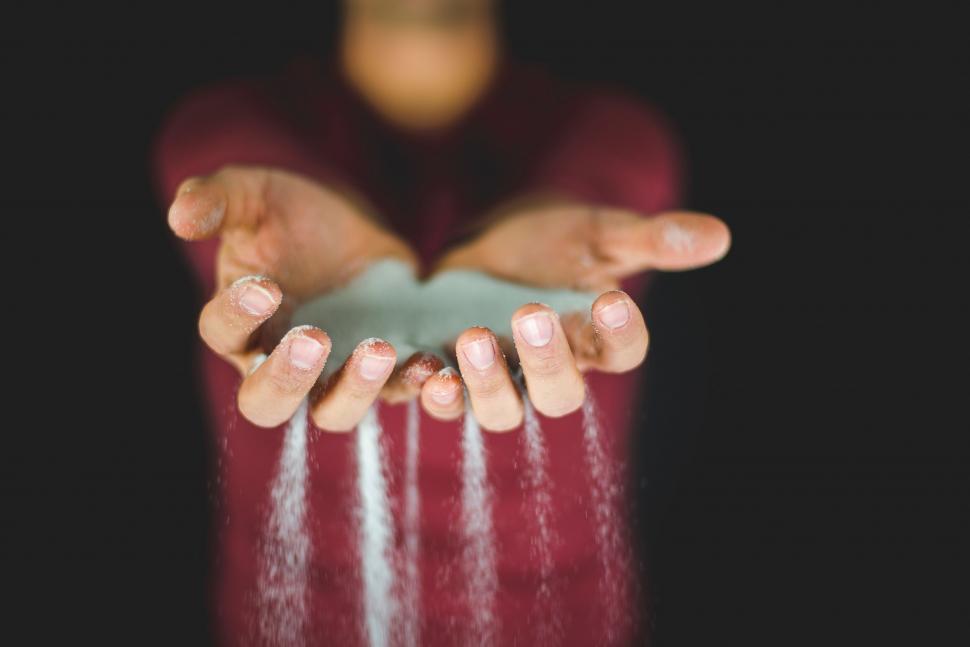 Free Image of Catching sparkling glitter in cupped hands 