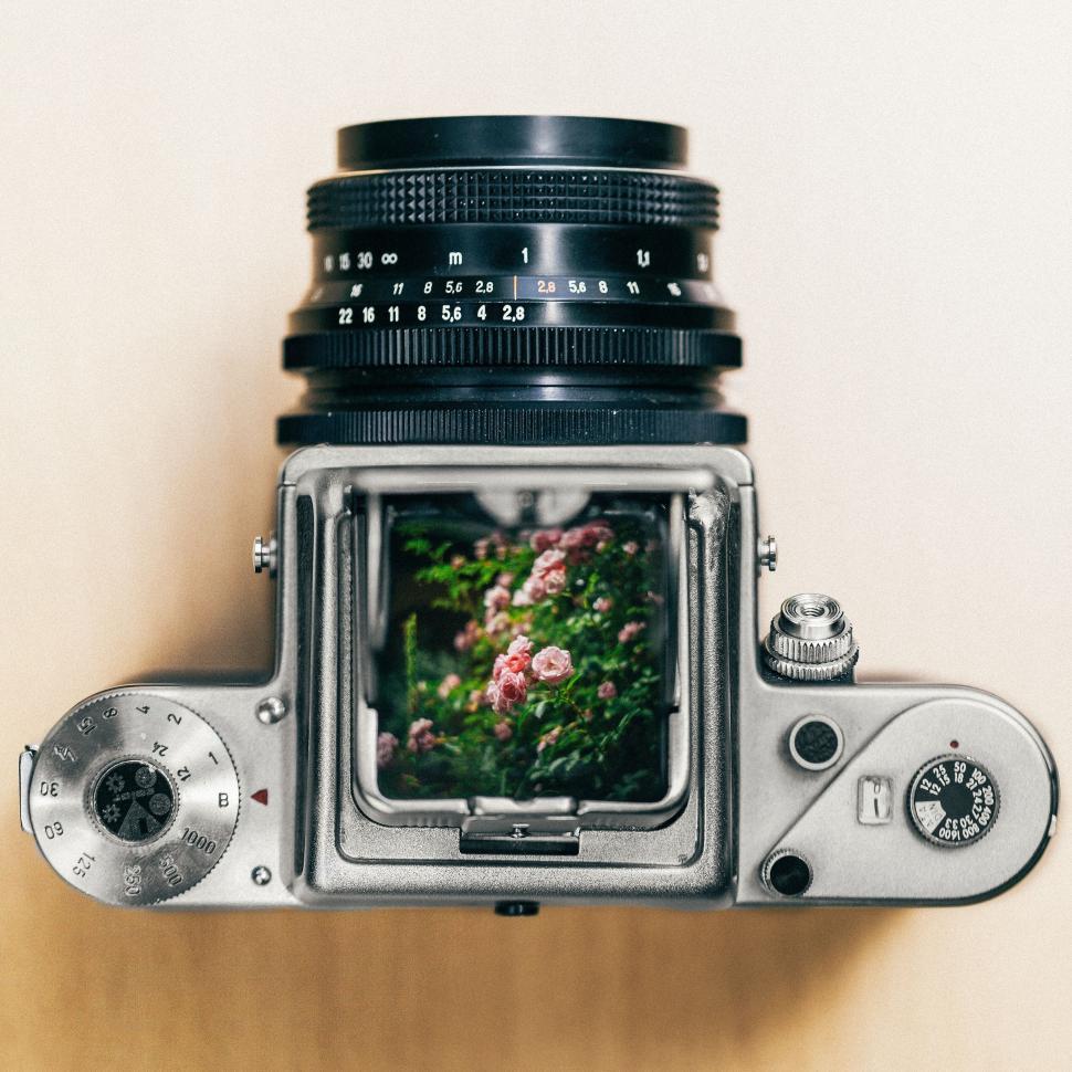 Free Image of Vintage camera on a wooden surface 