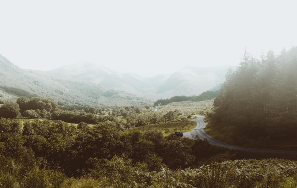 Free Image of Winding road through lush mountain landscape 