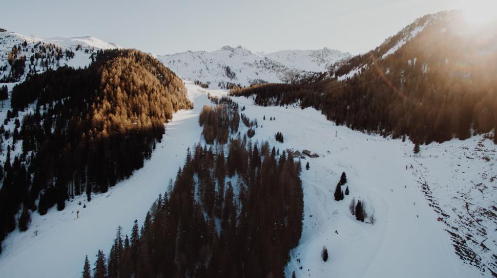Free Image of Aerial view of a river snaking through snow 