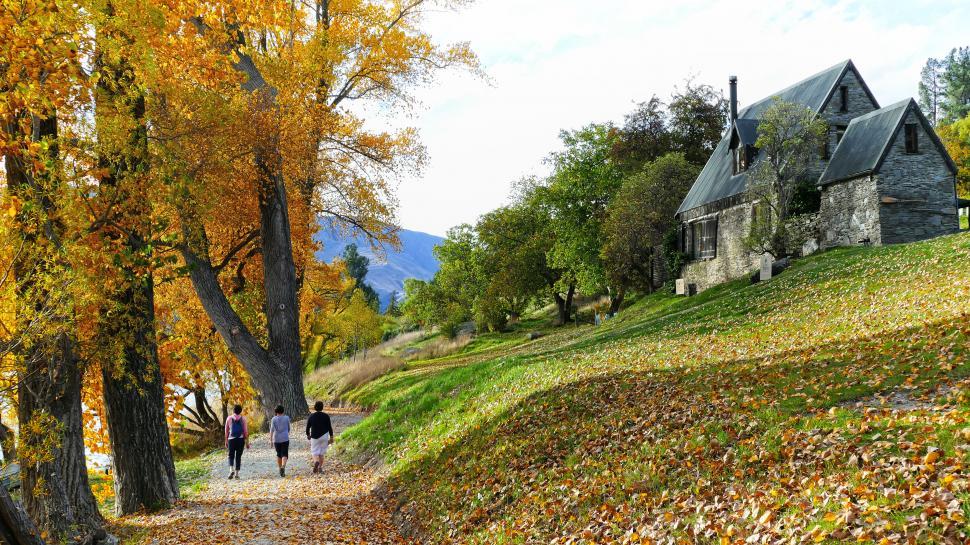 Free Image of Autumn stroll by the stone build church 