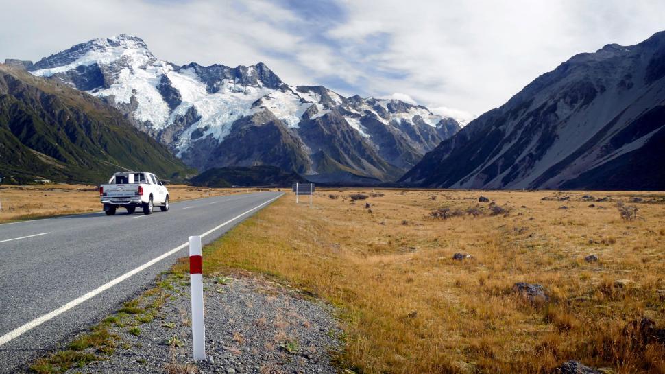 Free Image of Road trip through snowy mountain range 