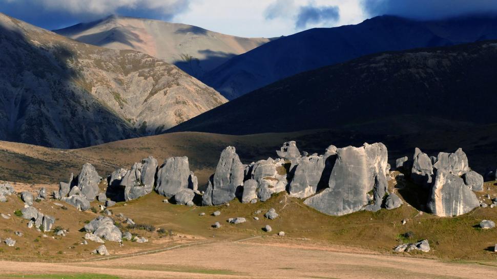 Free Image of Limestone rock formations under dramatic sky 