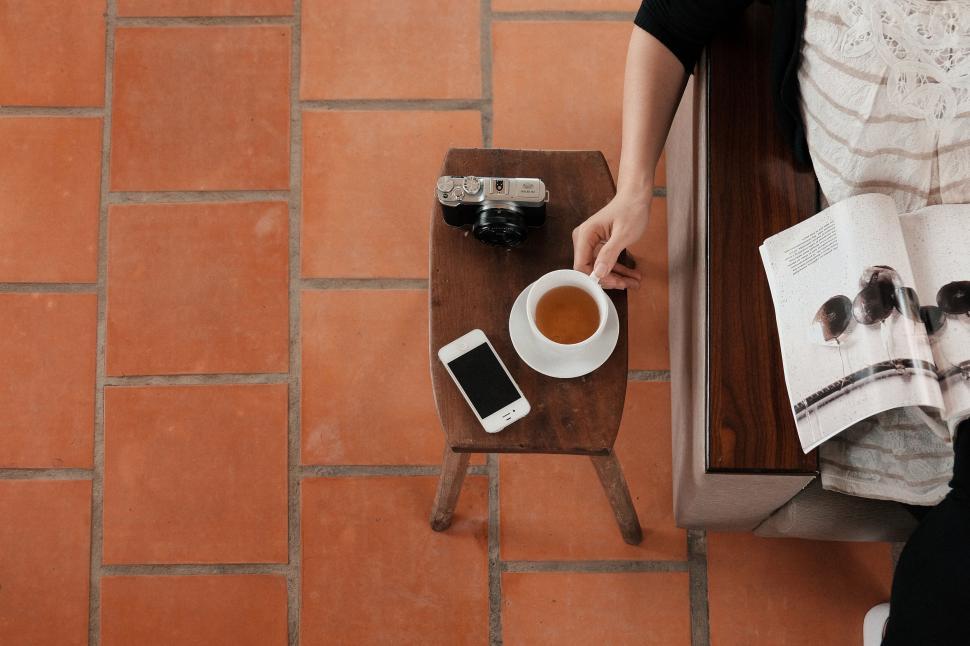 Free Image of Casual coffee and reading moment on a table 