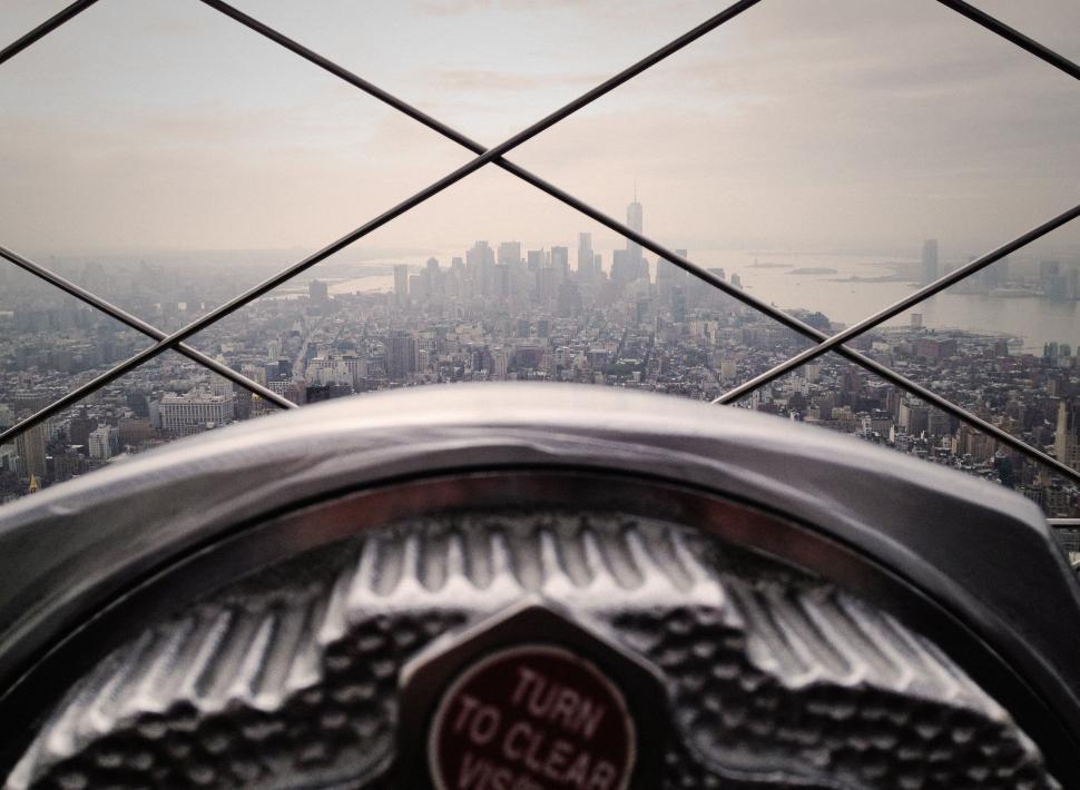 Free Image of View through binoculars at city skyline 