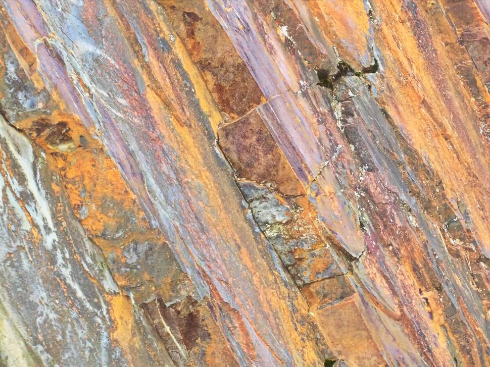 Free Image of Textured stone wall in earth tones 