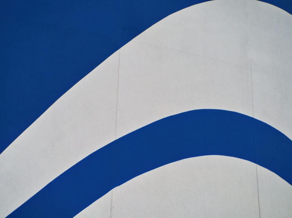 Free Image of Abstract blue and white curved pattern 