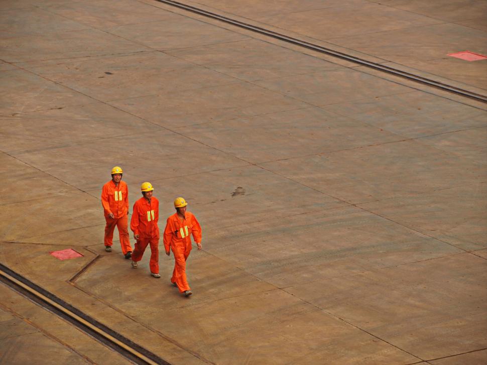 Free Image of Industrial workers in safety gear at a site 
