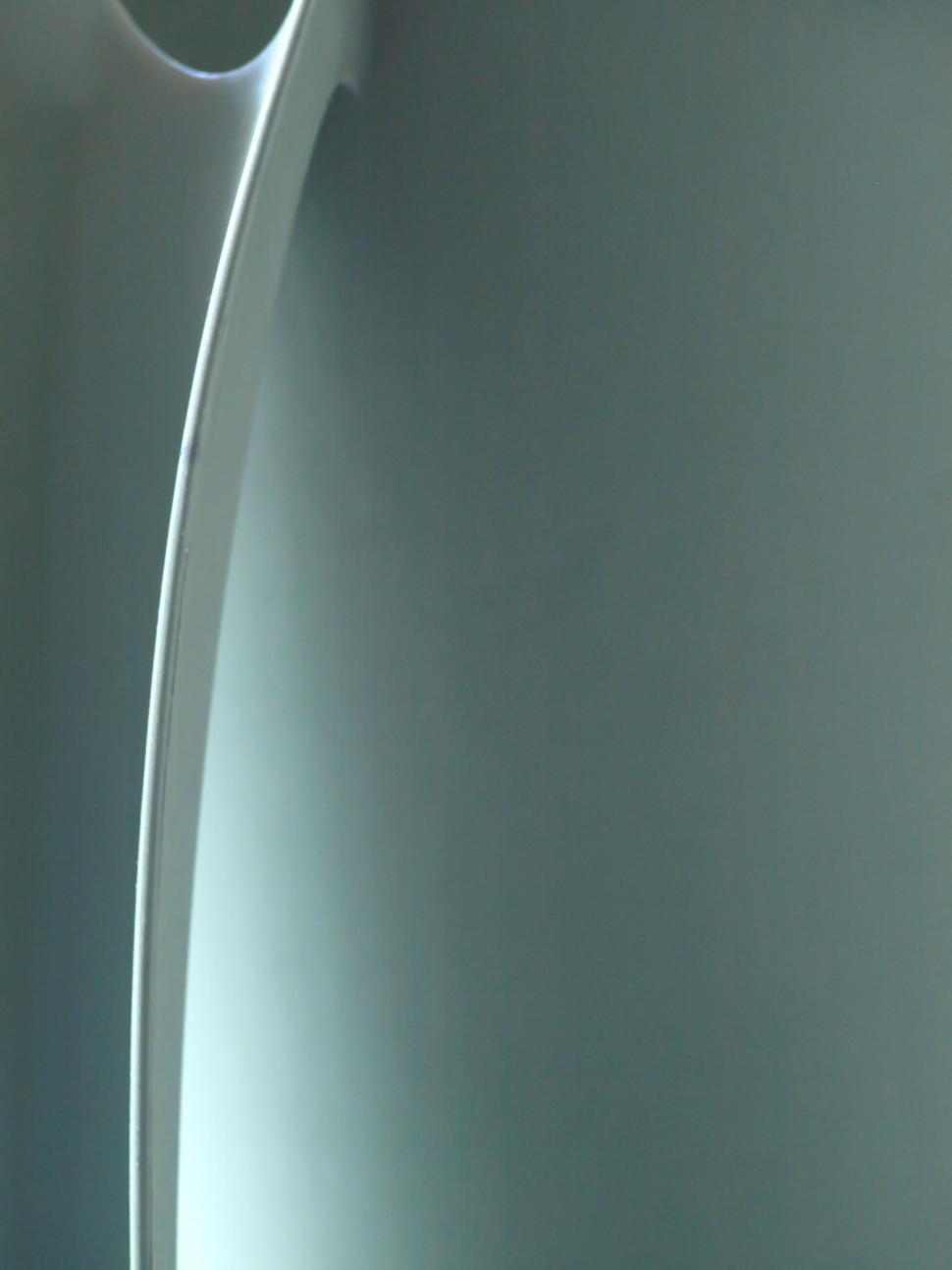 Free Image of Modern curved chair design with sleek lines 