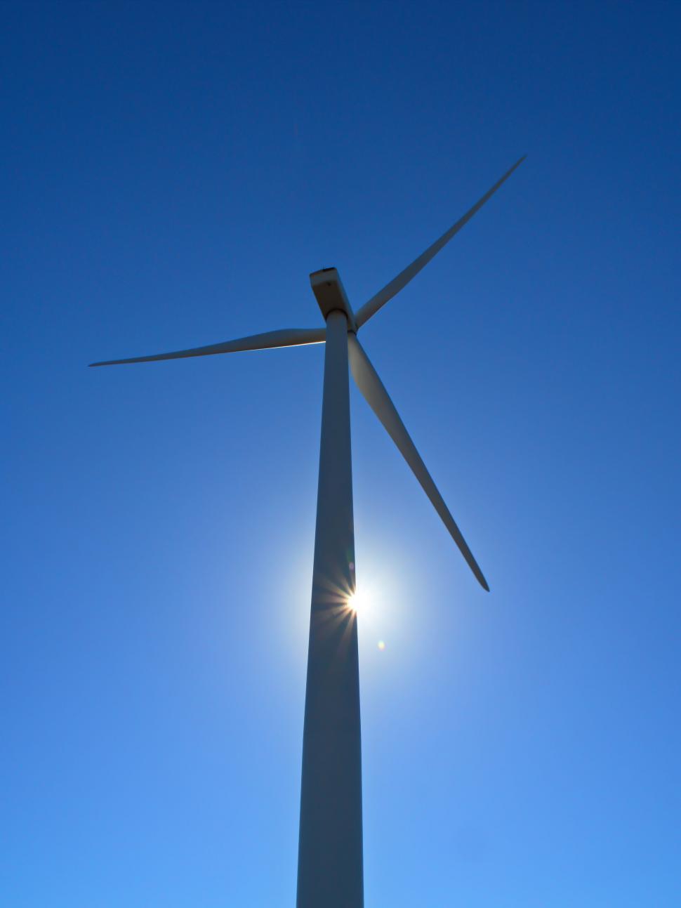 Free Image of Wind turbine against clear blue sky 