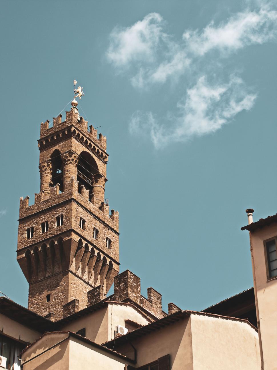 Free Image of Historic tower rising above buildings 