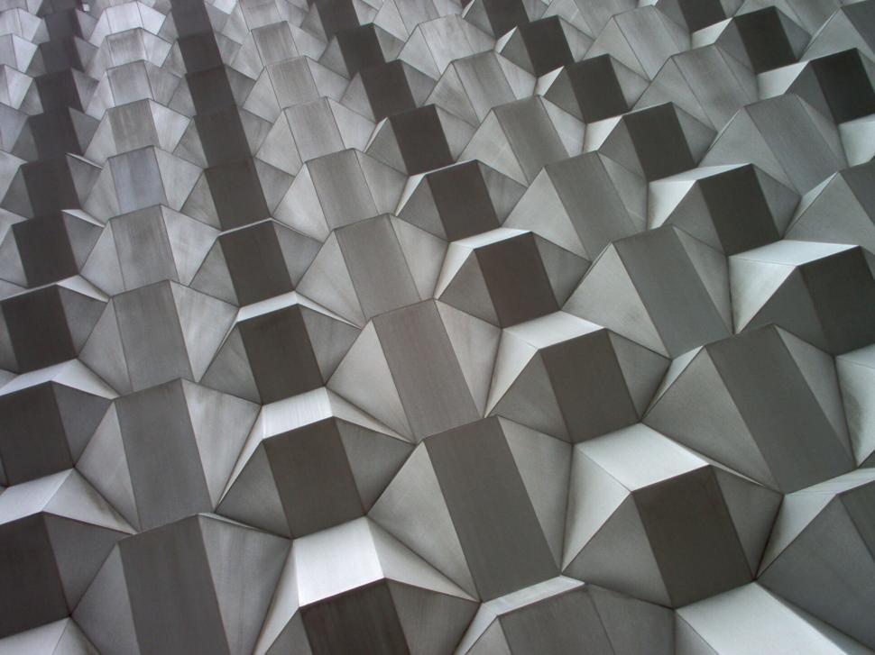 Free Image of Geometric metallic pattern with light reflections 
