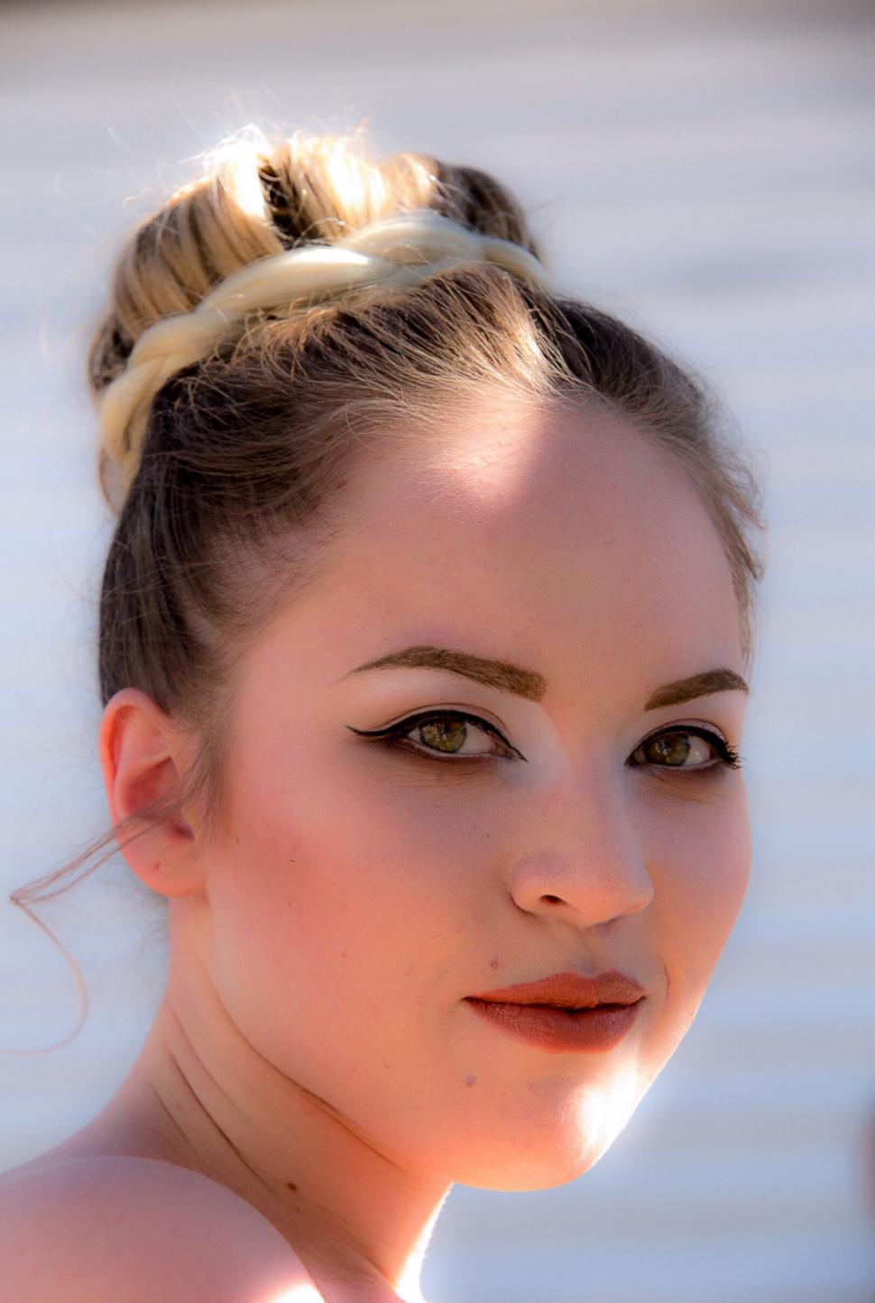 Free Image of Young woman with elegant hair and makeup 