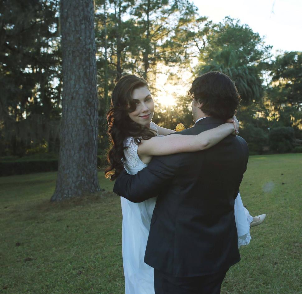 Free Image of Couple embracing at sunset in a romantic setting 