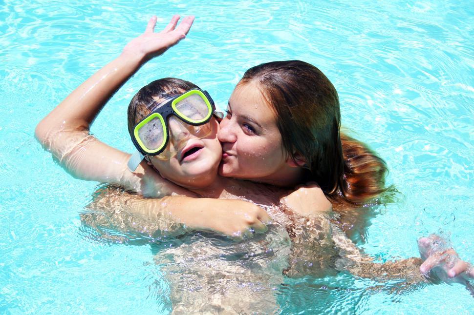 Free Image of Person swimming in pool without showing face 