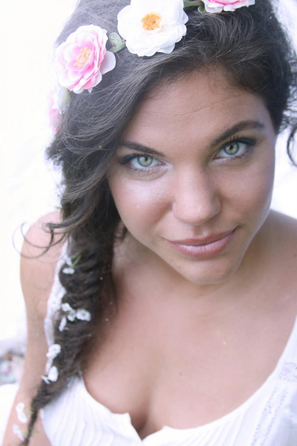 Free Image of Woman with floral headpiece closeup 