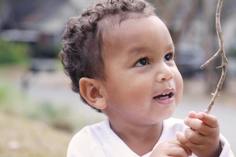 Free Image of Toddler admiring nature 
