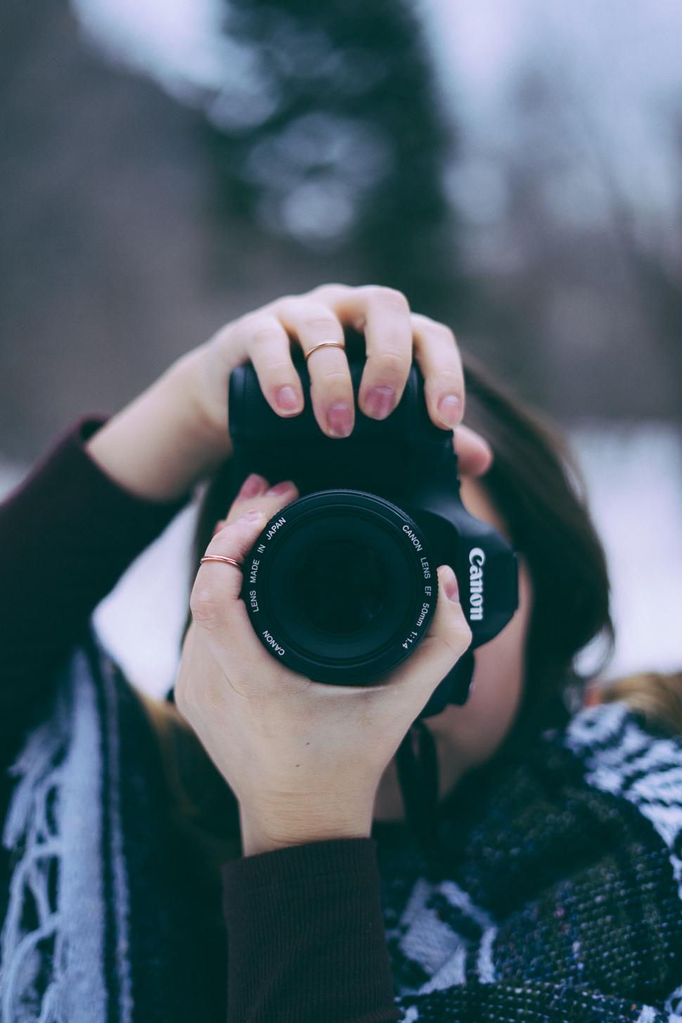 Free Image of Photographer Capturing Through Camera Lens 