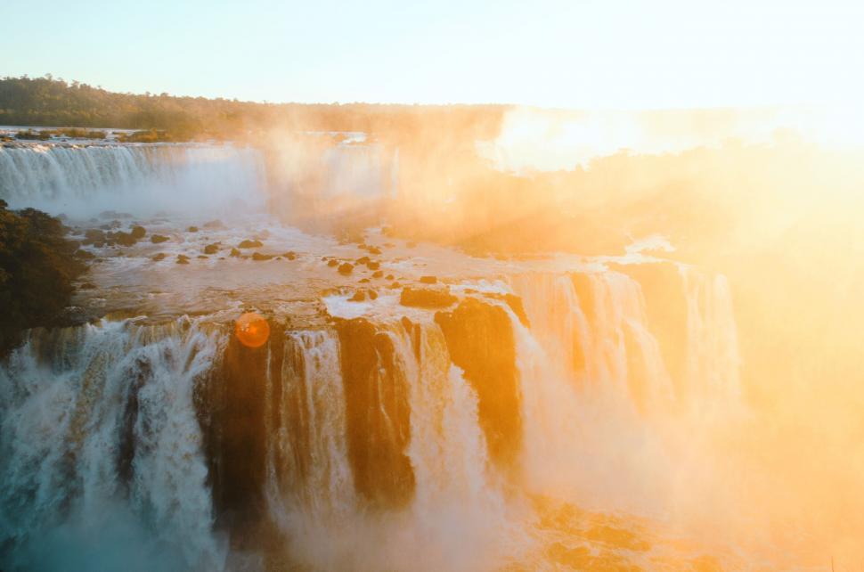 Free Image of Majestic Waterfall Surrounded by Mist 