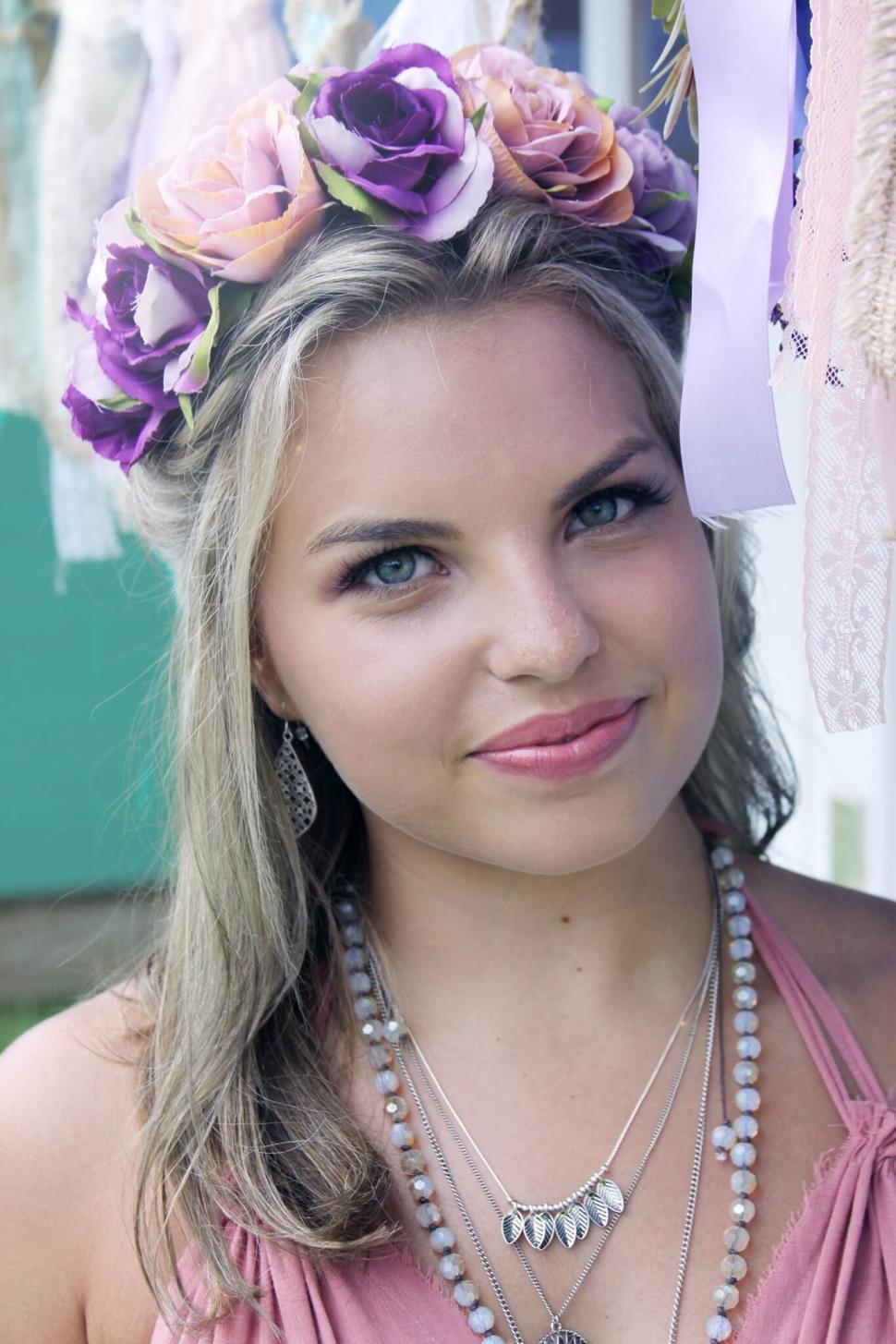 Free Image of Woman with floral crown looking up 