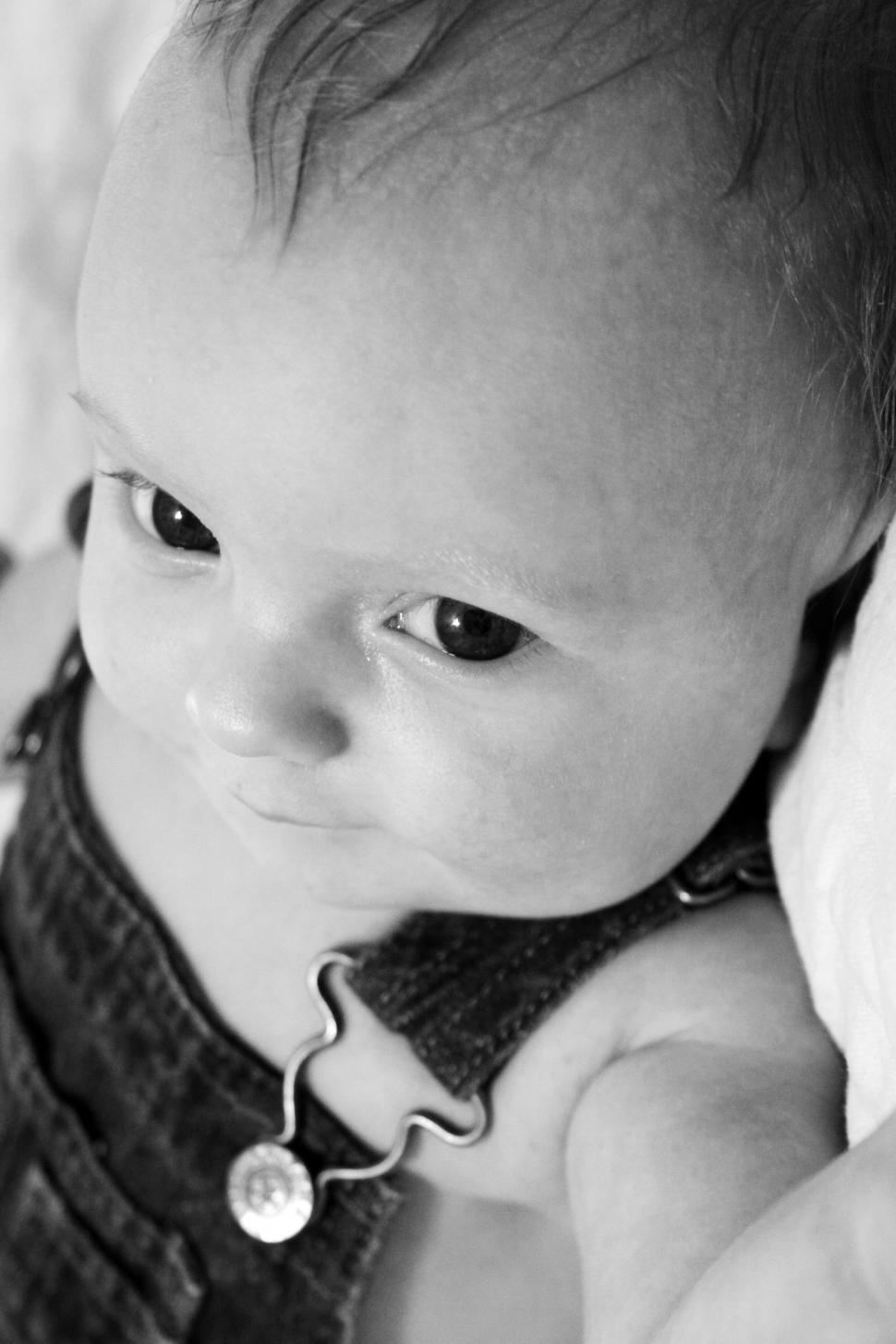 Free Image of Soft focus on a baby accessory with a blurred face 