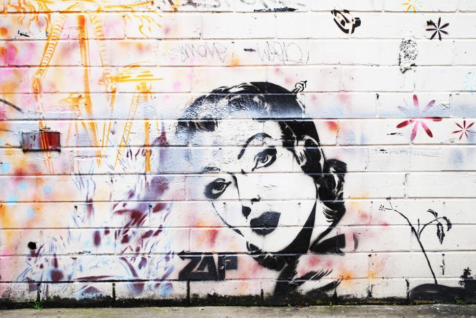 Free Image of Colorful graffiti wall with obscured artwork 