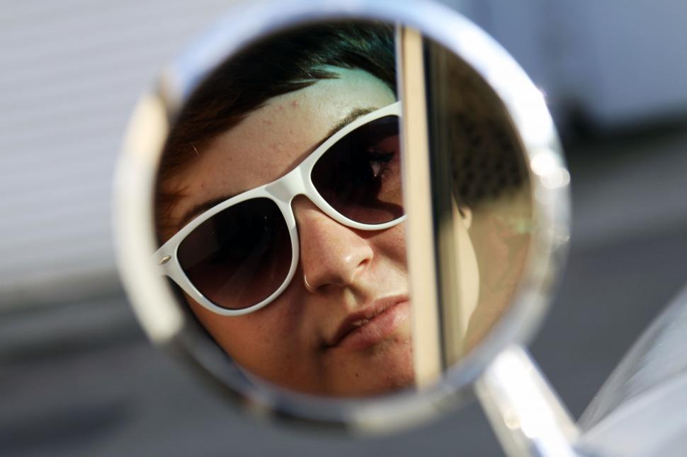 Free Image of Sunglasses reflecting the sky on a sunny day 