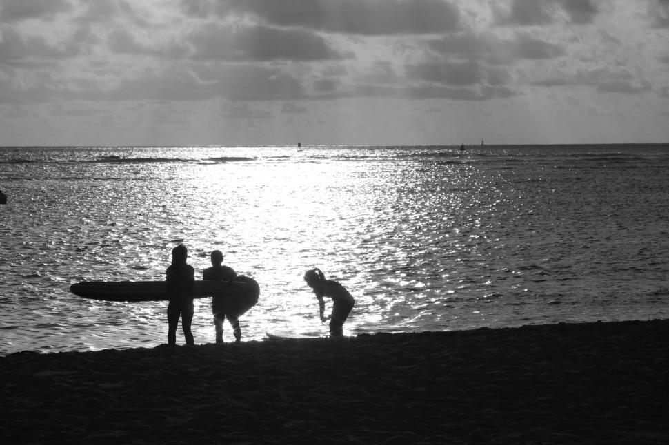 Free Image of Silhouettes at the beach during sunset 