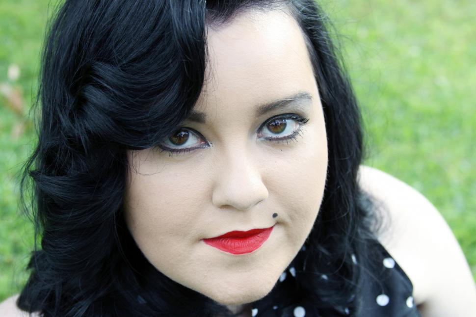 Free Image of Woman with bold makeup in nature 