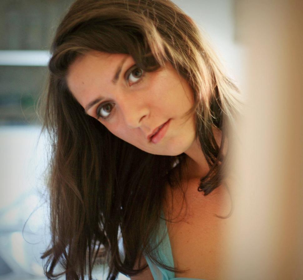 Free Image of Profile of a woman with long brown hair 
