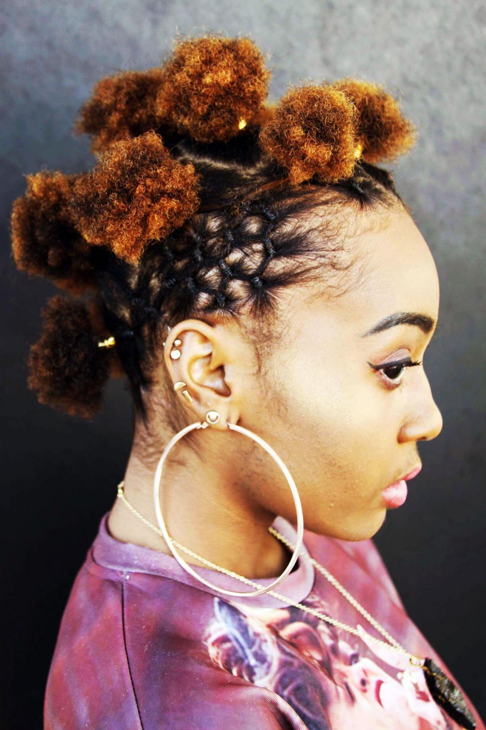 Free Image of Stylish hairdo with modern ear piercings 