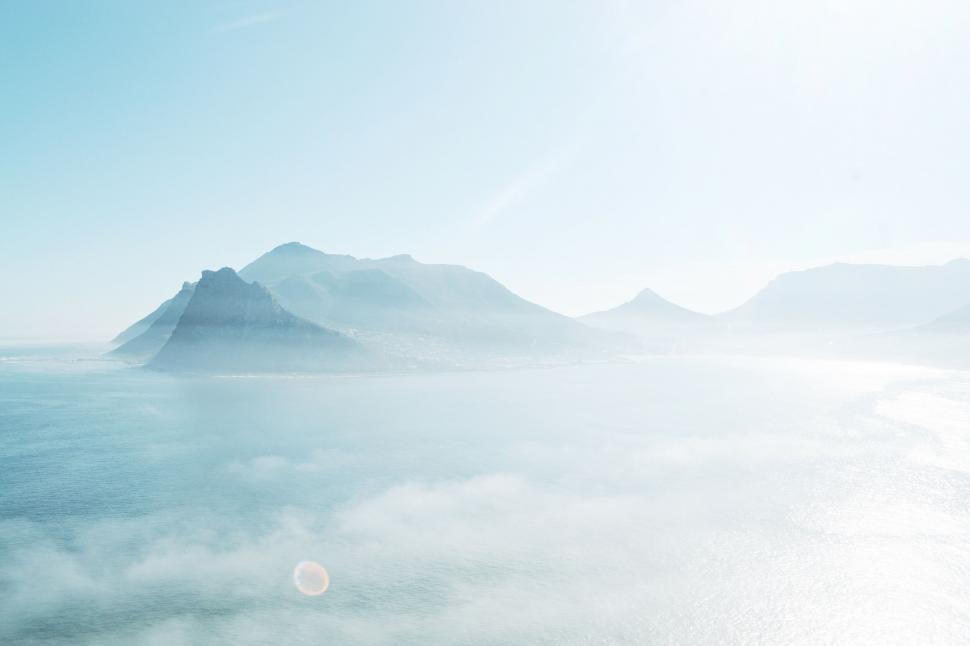 Free Image of Serene coastal scene in dreamy fog 