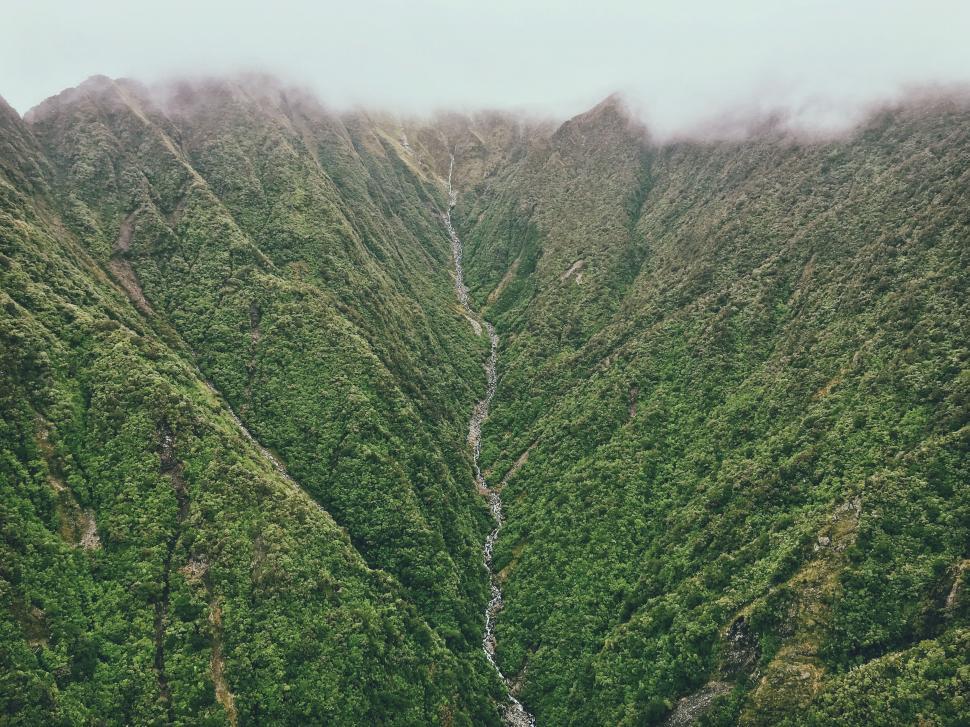Free Image of Misty mountain range with lush greenery 