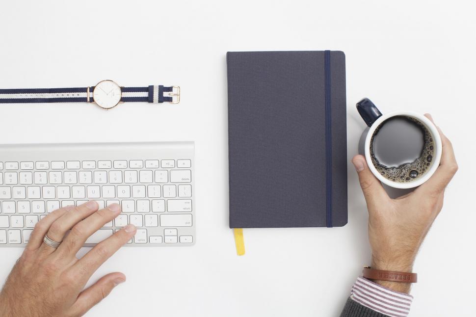 Free Image of Desktop setting with coffee and keyboard 